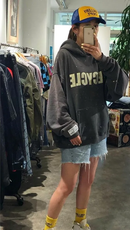 GALLERY DEPT. 90'S RECYCLE HOODIE WASHED BLACK 90'S washed hoodie with distressed eco-friendly slogans. Washed black S-XL. Ready-made garments are washed and dyed again. Multiple spots throughout the body are spray-faded. The ribs are cut and worn.
